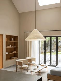 a living room filled with furniture and a skylight