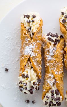 chocolate chips and cream crepes on a white plate