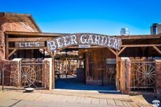 an old fashioned building with a sign that says lil's beer garden