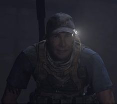 a man in the dark with a flashlight on his head