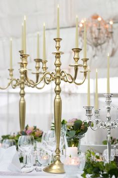 a gold candelabra sitting on top of a table