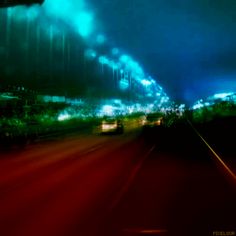 blurry photograph of an overpass at night