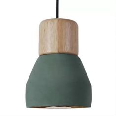 a green and wooden light hanging from a ceiling