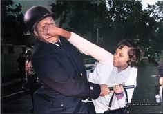 an old photo of a baseball player being hugged by a woman