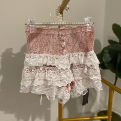 Ruffle Shorts Size M Super Stretchy To Fit And Get On But It Also Snugs And Hugs The Waist Material: Polyester Color: Pink Lace Ruffle Bottoms For Beach, Lace Ruffle Bottoms For The Beach, Feminine Lace Trim Bottoms For Brunch, Pink Lace Trim Bottoms For Spring, Pink Bottoms With Lace Trim For Spring, Beach Lace Bottoms With Ruffles, Feminine Ruffled Bottoms For Loungewear, Pink Bottoms With Lace Trim For Summer, Lace Ruffle Beach Bottoms