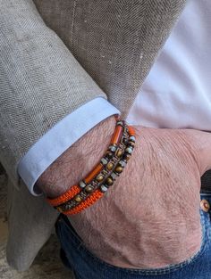 Magnificent trendy "protective" bracelet for men for a chic and casual look Composed of 3 fine bracelets, artisanal braiding with different knots made in 🇫🇷 Orange and brown braiding thread Natural tiger's eye stone, carnelian, mother-of-pearl and hematite Adjustable bracelet with sliding knot suitable for wrists from 17.5 cm to 18.9 cm maximum for size 1 (standard size) From 19 cm to 21 cm max: Size 2 (⚠️large size) Round tiger eye beads +- 4 mm Carnelian tube +- 13 x4mm Mother-of-pearl beads Casual Brown Hand Wrapped Braided Bracelets, Mens Bracelet Designs, Mens Jewerly, Macrame Bracelet Patterns, Bracelets Design, Beads Bracelet Design, Tiger Eye Beads, Protection Bracelet, Eye Beads