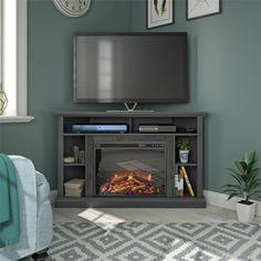 a flat screen tv mounted on top of a fireplace