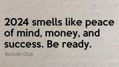 a white wall with a black quote on it that says, 2012 smells like peace of mind, money, and success be ready