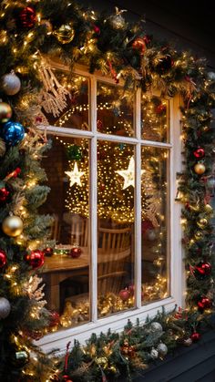 a window decorated with christmas decorations and lights