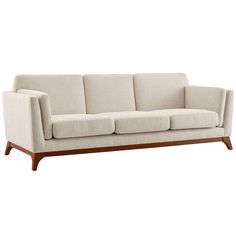 a white couch with wooden legs on a white background