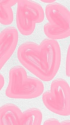 pink hearts painted on white paper