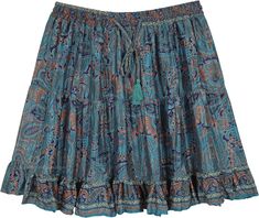 A slightly shiny and smooth short skirt with three tiers of lightweight smooth fabric. This peacock blue skirt has paisley and floral print all over the fabric with a blue slightly frilled bottom. #tlb #TieredSkirt #Floral #Printed #Paisley #Fairycoredress #VacationShortSkirt #BeachSkirt Blue Tiered Lined Skirt, Blue Lined Tiered Skirt, Blue Bohemian Tiered Bottoms, Flowy Paisley Print Tiered Skirt, Blue Tiered Skirt With Lining, Bohemian Blue Tiered Bottoms, Flowy Tiered Skirt With Paisley Print, Bohemian Blue Mini Length Bottoms, Blue Bohemian Mini Skirt With Lined Detail