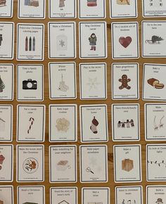 many cards are displayed on a table with different things in the card game, which includes pictures and words