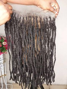 If you currently have locs but have a thinning hairline, don't worry we have got you covered. Send us a picture of your locs and we can create a lace front unit for you to replace those locs you lost.  Details of displayed unit: 13x4 lace front Human hair locs  These are pencil size locs please. Not sisterlocs.  4c hair type #1b 18 inches  Processing time is 4 to 6 weeks NB: Price will depend on size of lace area, number of locs and size of locs. Note: Before placing your order, please use a tap