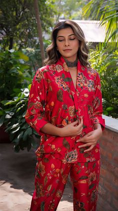 Make heads turn with out printed co-ord set in silk. Straight Pants with Blazer Jacket. Made in printed raw silk. Color : Red. Fully lined. No of Components : 2. Model height is 5.6” and is wearing a size S. Wash Care : Dry Clean Only. Festive Silk Printed Sets, Red Silk Sets For Summer, Festive Silk Pant Set With Floral Print, Festive Red Printed Set, Silk Red Sets With Floral Print, Red Silk Sets With Printed Motifs, Printed Silk Sets With Long Sleeves, Red Printed Festive Sets, Red Silk Sets With Floral Print