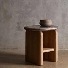 a small table with a bowl on it