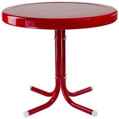 a red table with two white legs and a round glass top on an iron stand