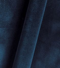 a close up view of a blue velvet fabric