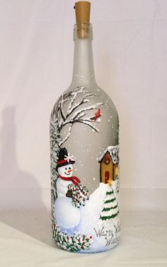 a bottle with a snowman painted on it