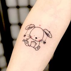 a small rabbit tattoo on the arm