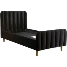 a black bed with gold legs and headboard