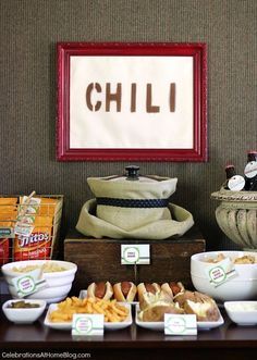 a buffet table filled with different types of food and snacks on it's sides