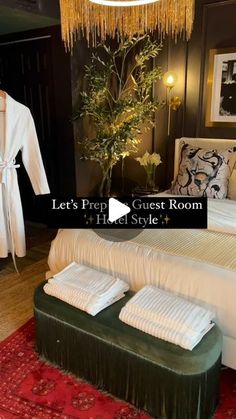 a bed room with a neatly made bed and bathrobe