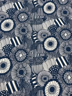 blue and white flowers are arranged in an intricate pattern on a black - and - white background