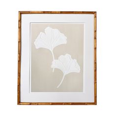 a white flower is in a gold frame