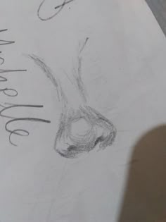 a pencil drawing of a nose with the word welcome written on it