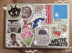 an assortment of stickers on a suitcase