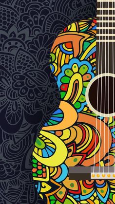 an acoustic guitar sitting on top of a blue and yellow floral background with paisley designs