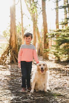 a boy and his dog in the woods