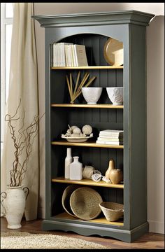 a book shelf with books and other items on it