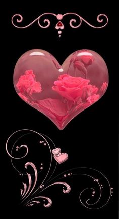 a heart with pink flowers and swirls in the center on a black background photo