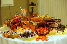 a table topped with lots of different types of foods and desserts on top of it