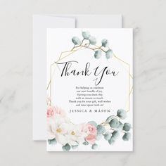 thank card with watercolor flowers and greenery in the center on a marble surface