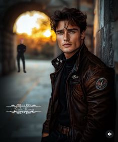 a man in a leather jacket standing next to a wall