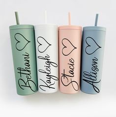 three personalized tumblers with straws in each one and the word love is written on them