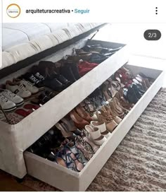 a bed with two drawers that have shoes in them on the bottom and bottom shelves