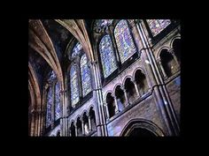 the inside of a cathedral with stained glass windows