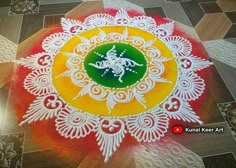 a colorful rangdi design on the ground with white and yellow colors, in an intricate pattern