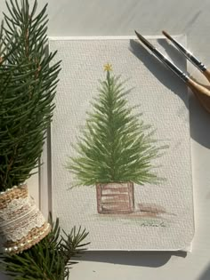 a painting of a small pine tree in a pot on a piece of white paper