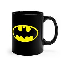 the batman symbol on a black coffee mug