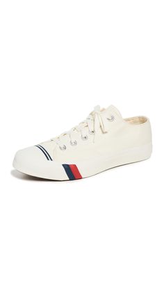 PRICES MAY VARY. Durable 12.5 oz Canvas with contrast stitching Flat cotton laces Aluminum Eyelets Molded footbed with open cell foam for breathability Red and blue power stripe details with an off-white midsole closure type: lace-up Fabric Canvas, Canvas Sneakers, Royal Fashion, White Canvas, Fashion Sneakers, Contrast Stitch, Lace Closure, Cotton Lace, Keds