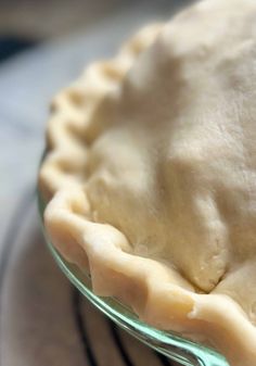 an uncooked pie sitting on top of a table