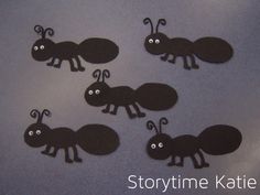 four black paper antlers with googly eyes are on a gray surface and there is text that says storytime kate