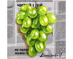 a bunch of green grapes are hanging from a newspaper clipping with the words bawkenup written in russian