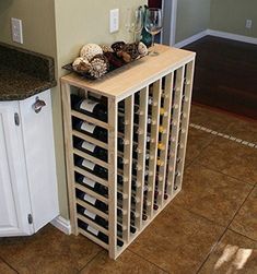 a wine rack in the corner of a kitchen