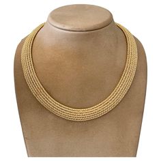 A true classic, this lovely mesh necklace is an absolute statement piece. The movement throughout the necklace is so smooth and subtle that it is easily worn without a thought, but the profile is bold and is visually just gorgeous. It was designed and made by the Italian jeweler Unoaerre and weighs 43.73 grams, executed entirely in 18 K yellow gold. Push-button box clasp and a supplementing side-latch safety clasp. Dimensions: 45 cm wearable length and 1.43 cm wide. QUESTIONS? Contact us right a Mesh Necklace, A Thought, Box Clasp, The Movement, Push Button, Estate Jewelry, Statement Pieces, Choker Necklace, Jewelry Necklaces